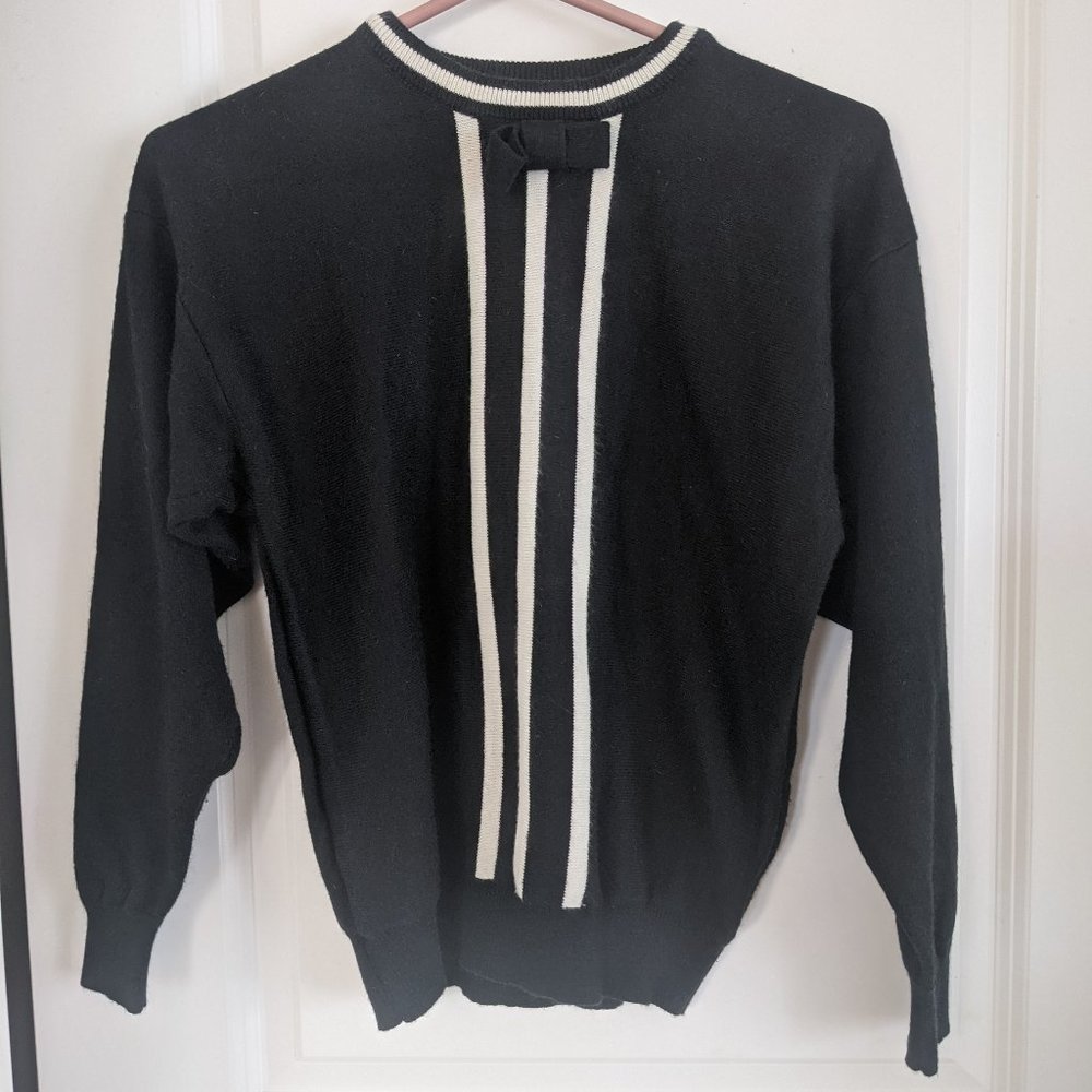 Soft black and white knit sweater with bow